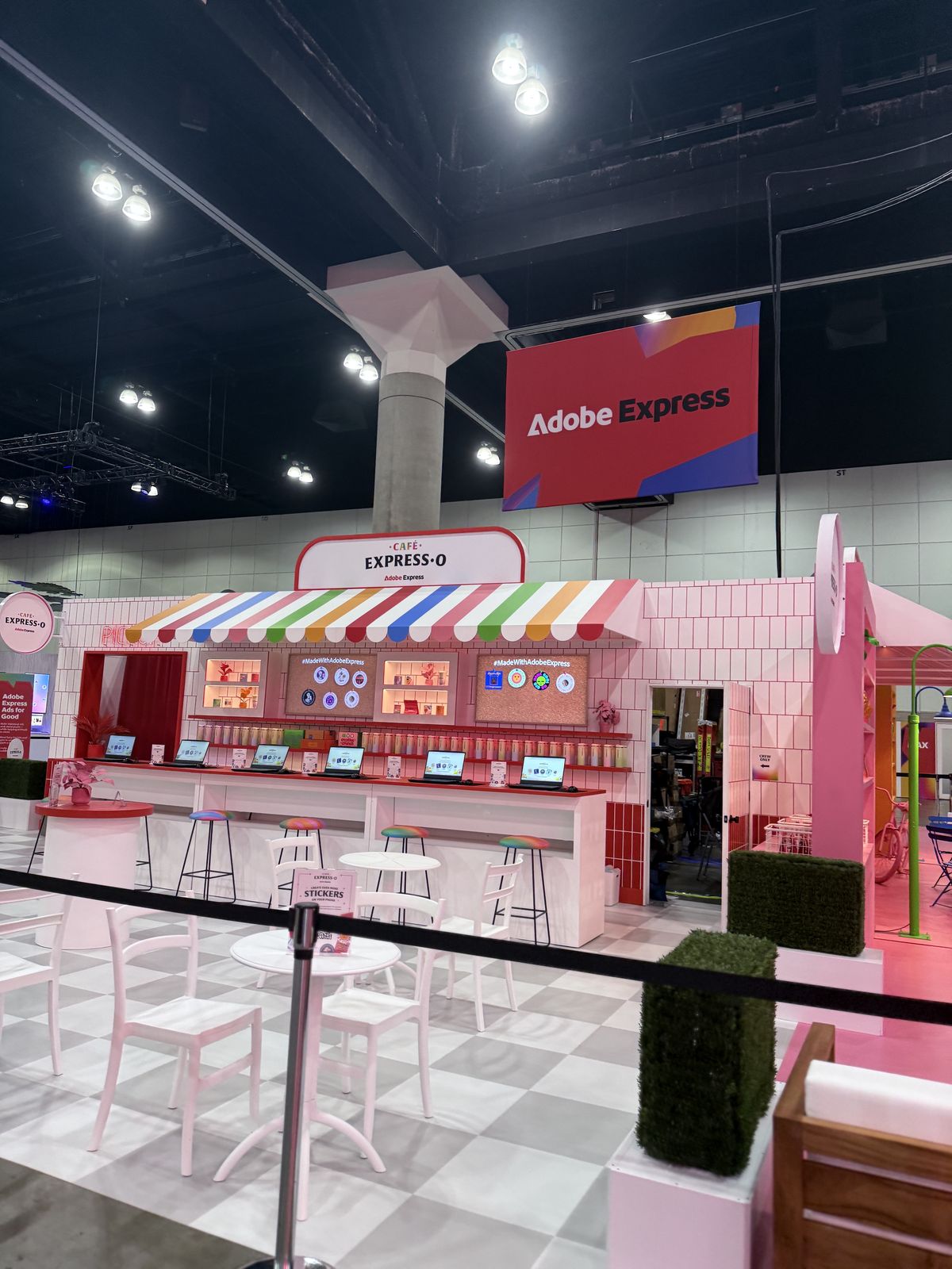 Colorful branded cafe-style activation booth on a convention floor